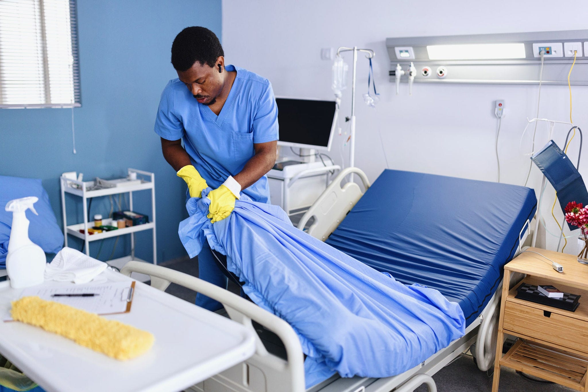 offensive waste being removed from hospital bed